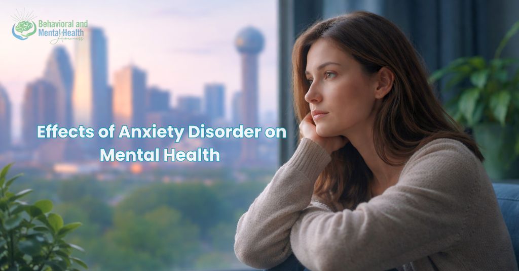 Effects of Anxiety Disorder on Mental Health – young woman sitting near a window with blurred Dallas skyline in the background, looking thoughtful and emotionally overwhelmed in soft morning light.